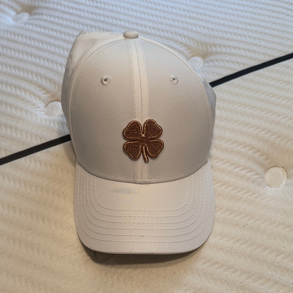 Black Clover Live Lucky women’s golf hat with gold Clover Patch